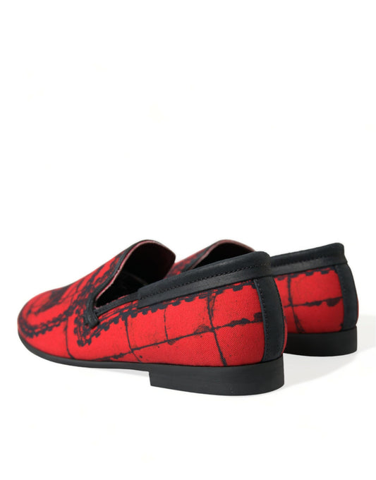 Pair of red and black loafers with embroidered design