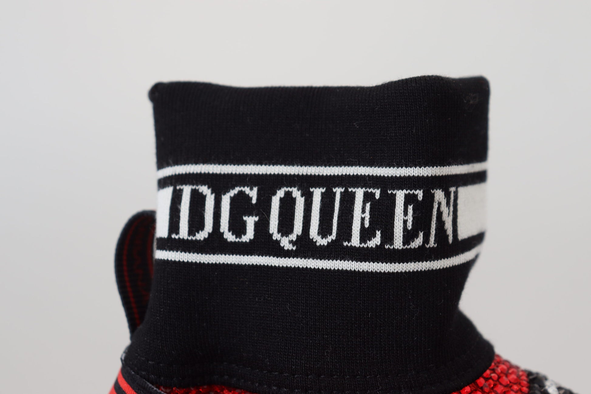 Black sock with white lettering reading DG DUFFEN
