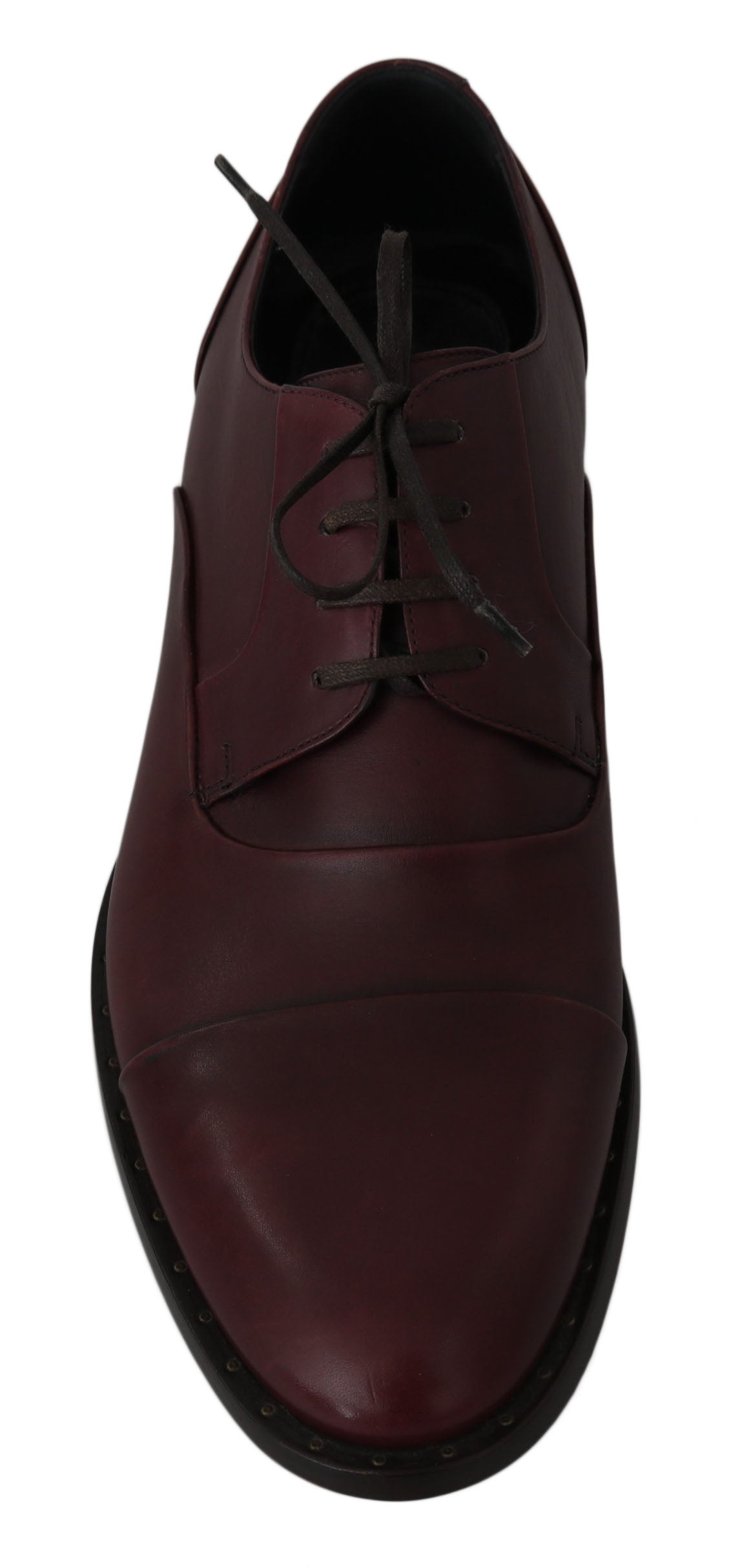 A single shoe against a neutral background. It is a men's dress shoe with a dark red or burgundy color. The shoe features