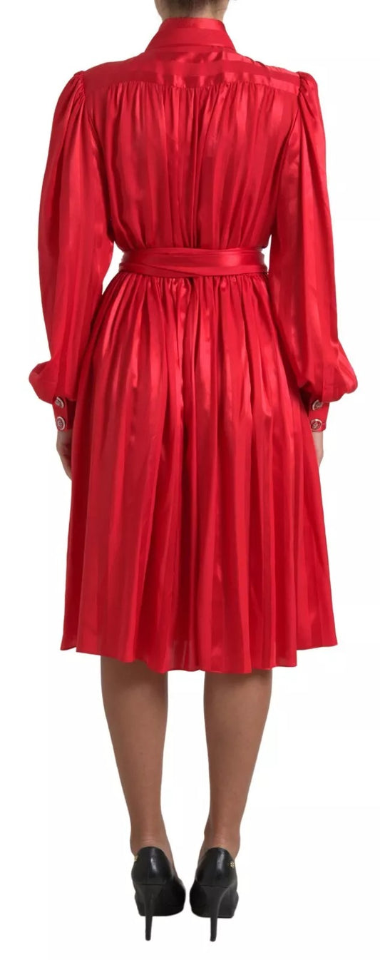 A red satin silk midi dress with a belt and button detail