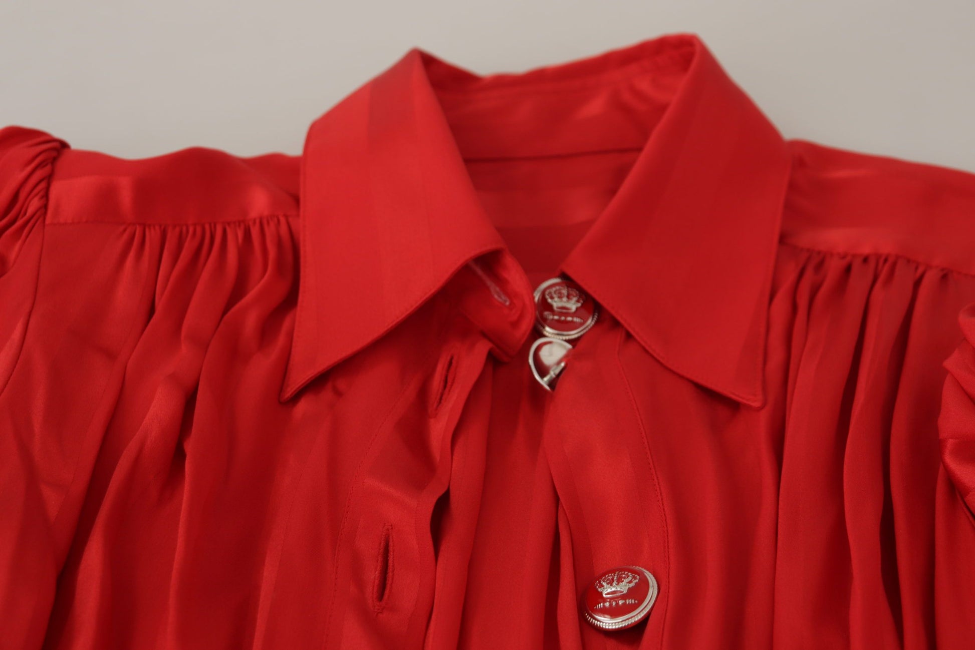 A red button down belted midi satin silk dress from Dolce & Gabbana