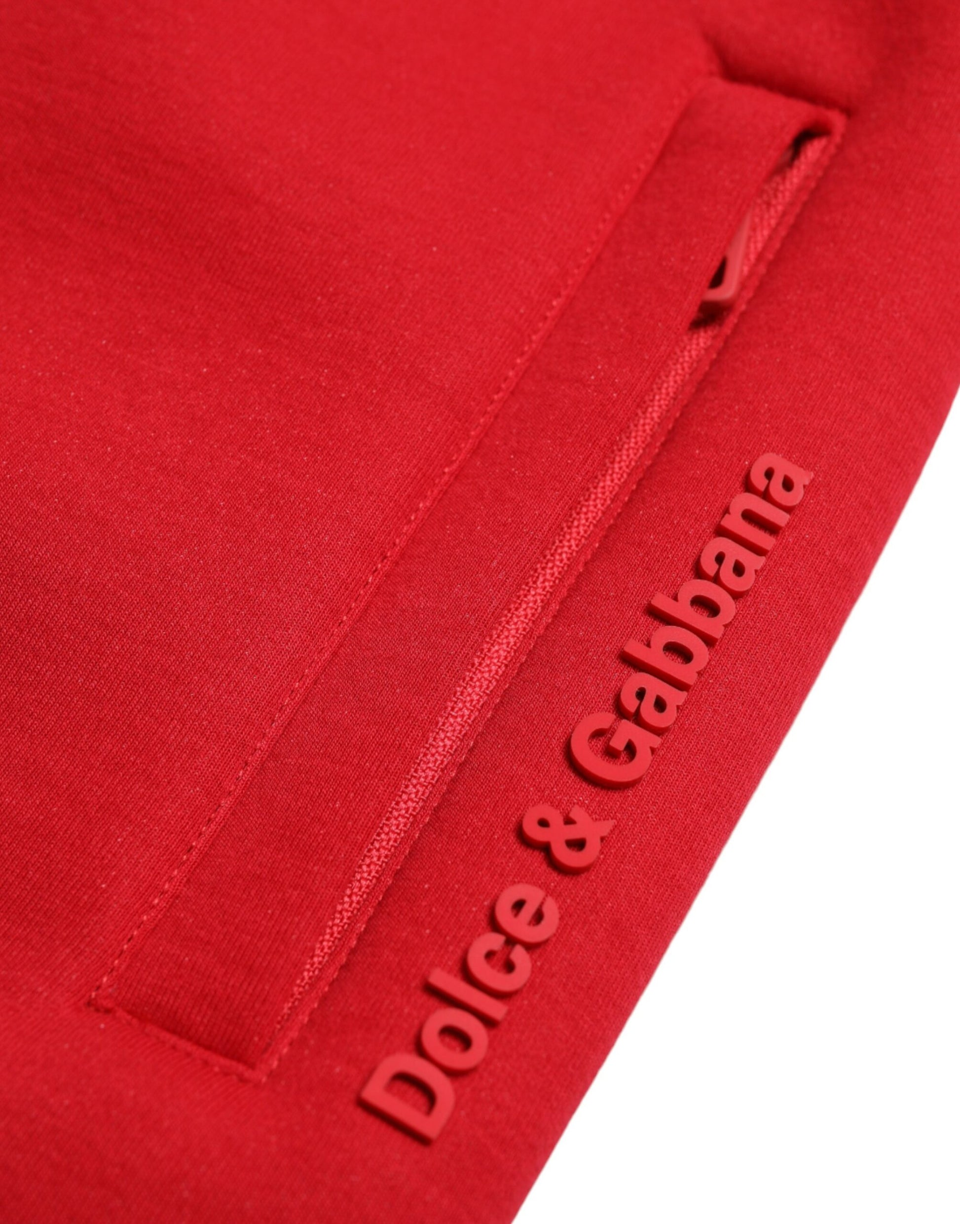 Red fabric with embroidered brand name