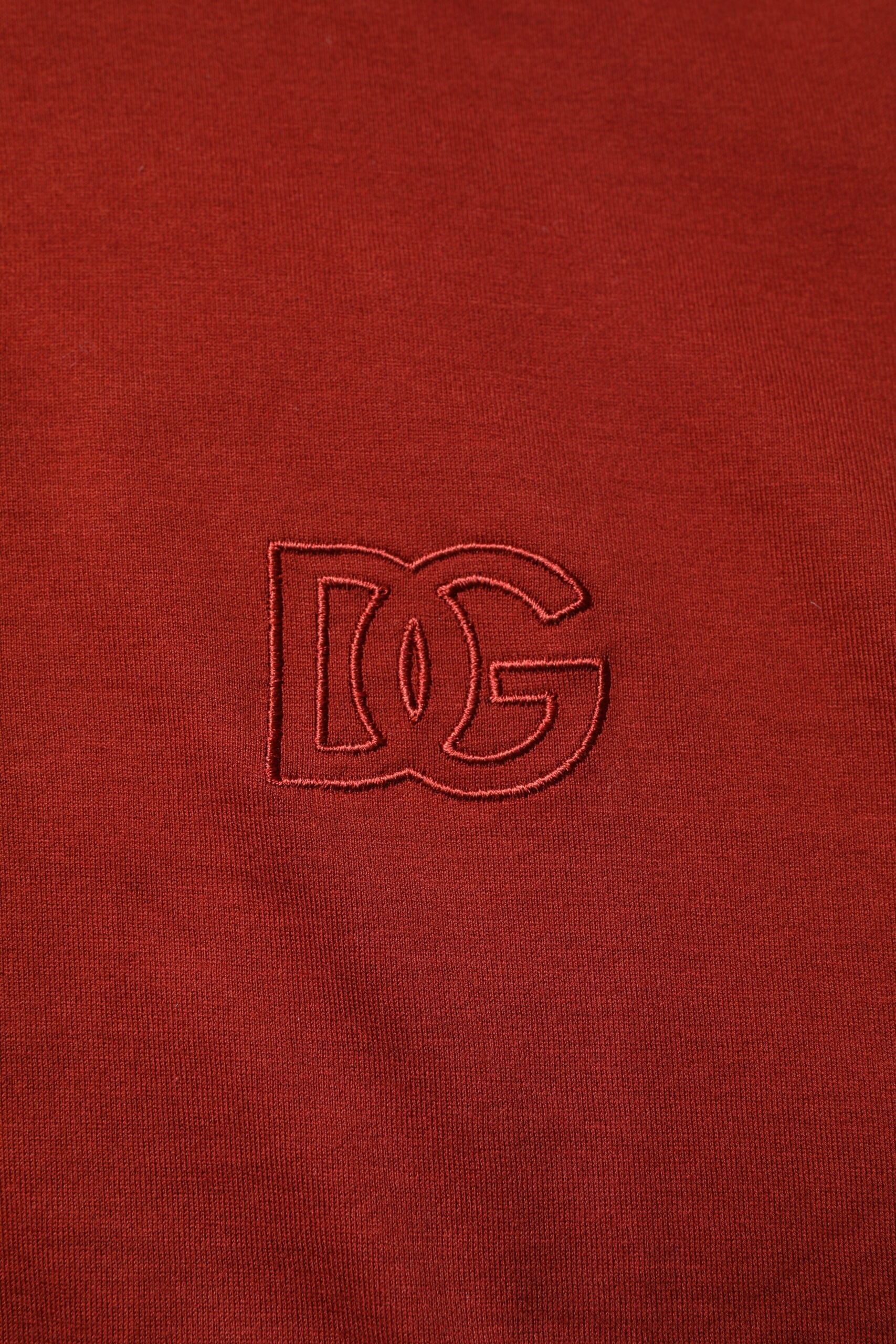 Red fabric with embroidered logo