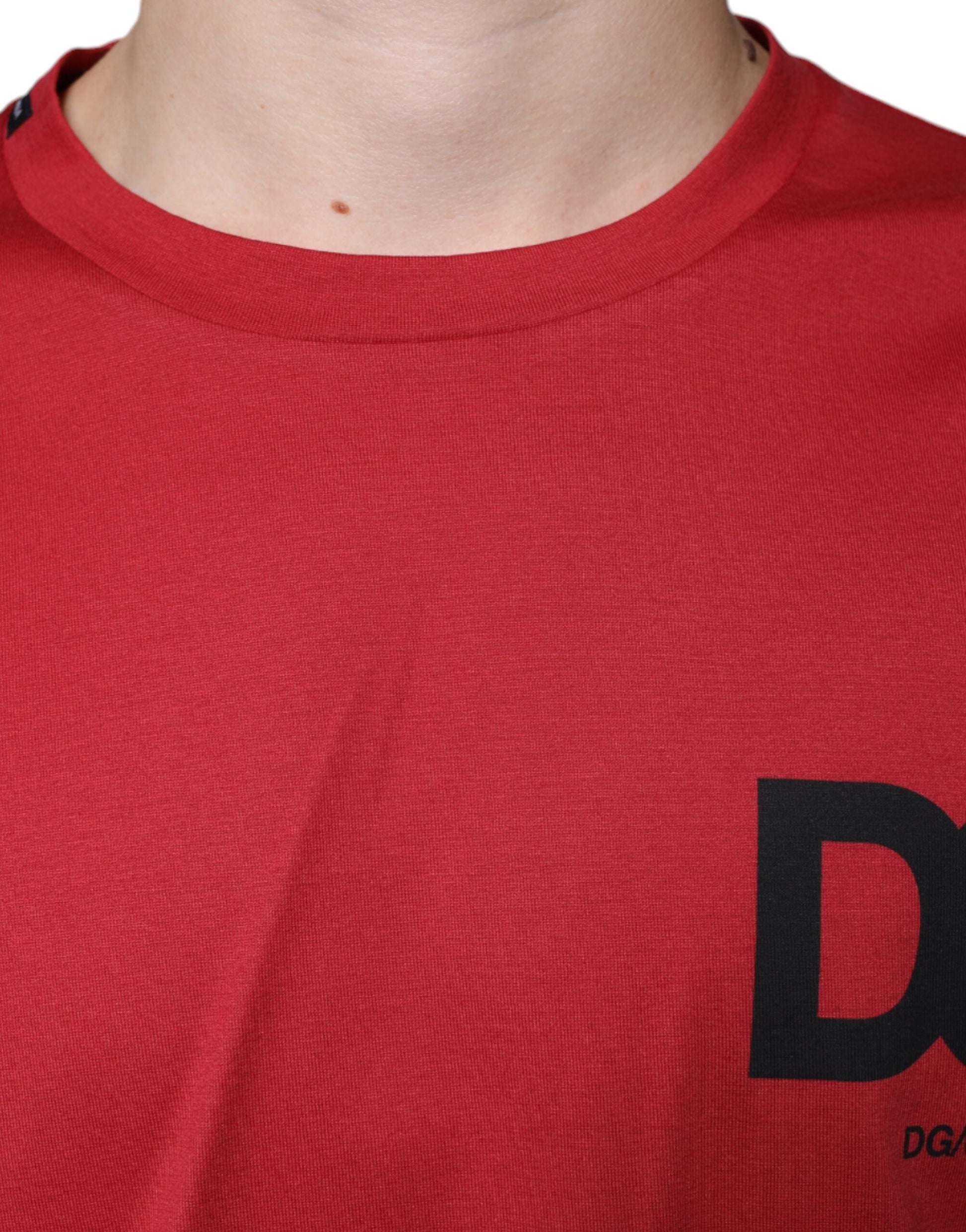 Red shirt with black letters on front