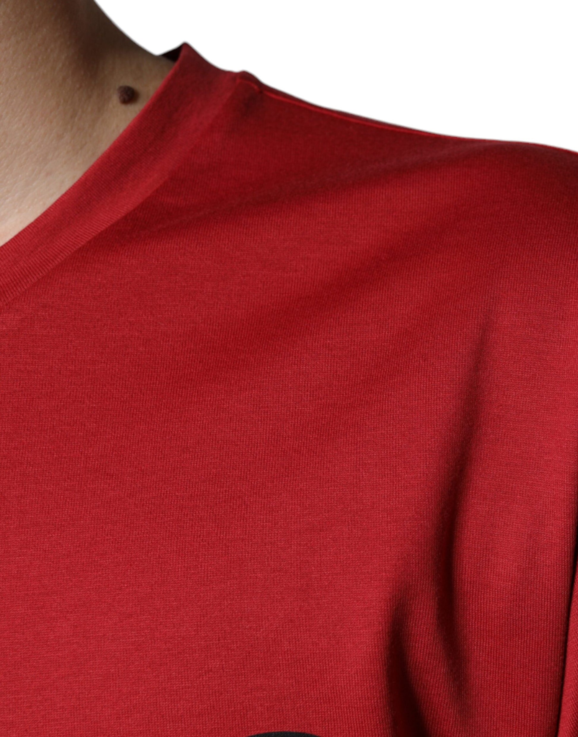 Red short sleeve shirt on a person's torso
