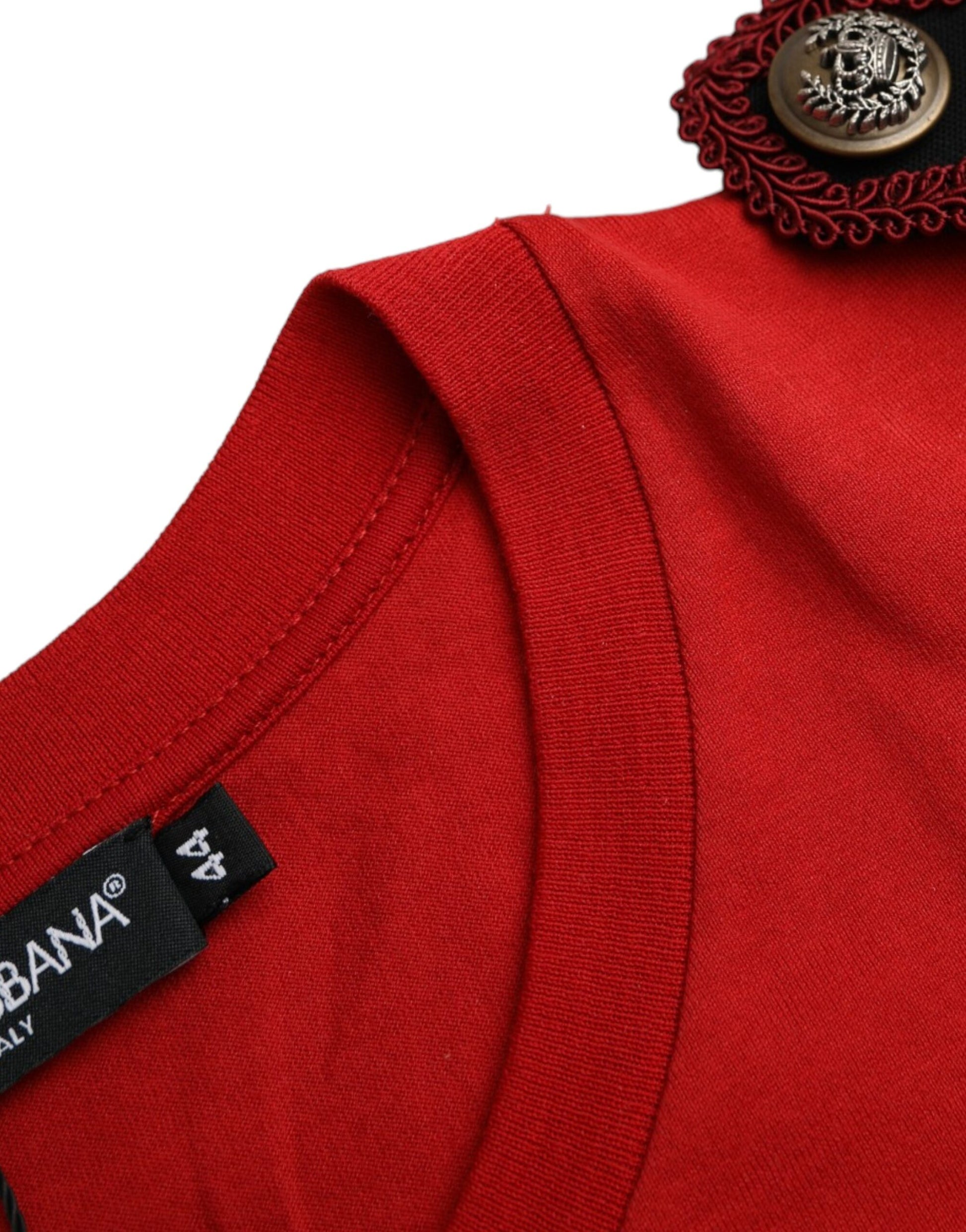 Red shirt with black buttons and a label on the inside collar