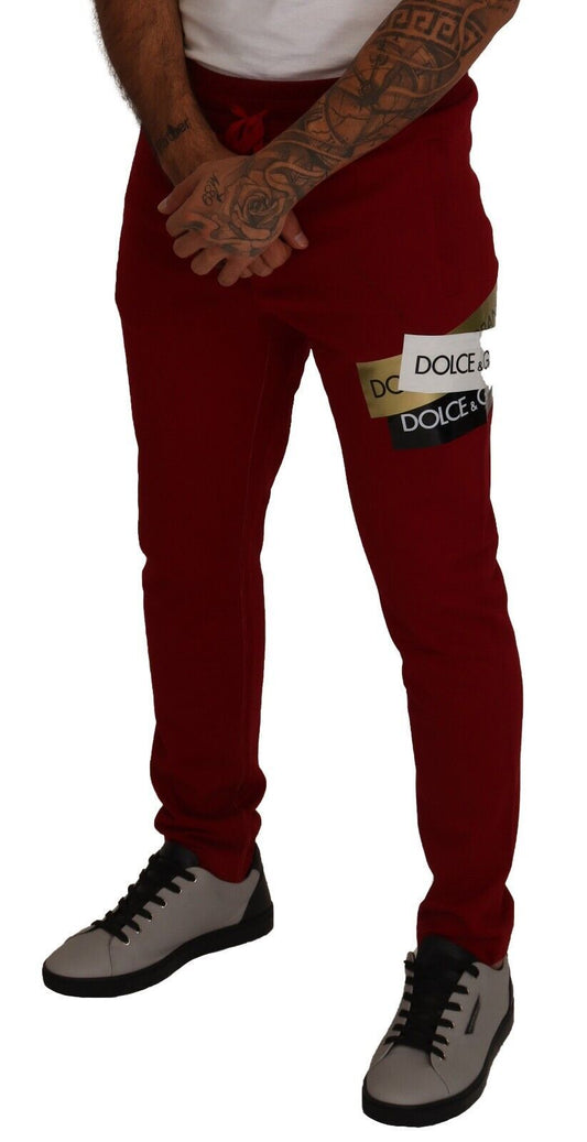 Man wearing red pants and white sneakers