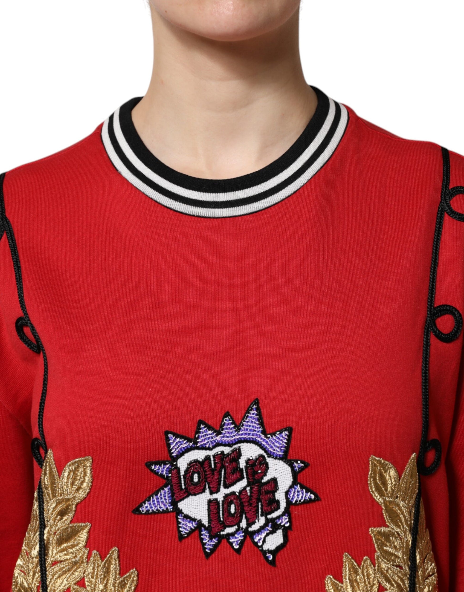 Red sweater with embroidered love graphic