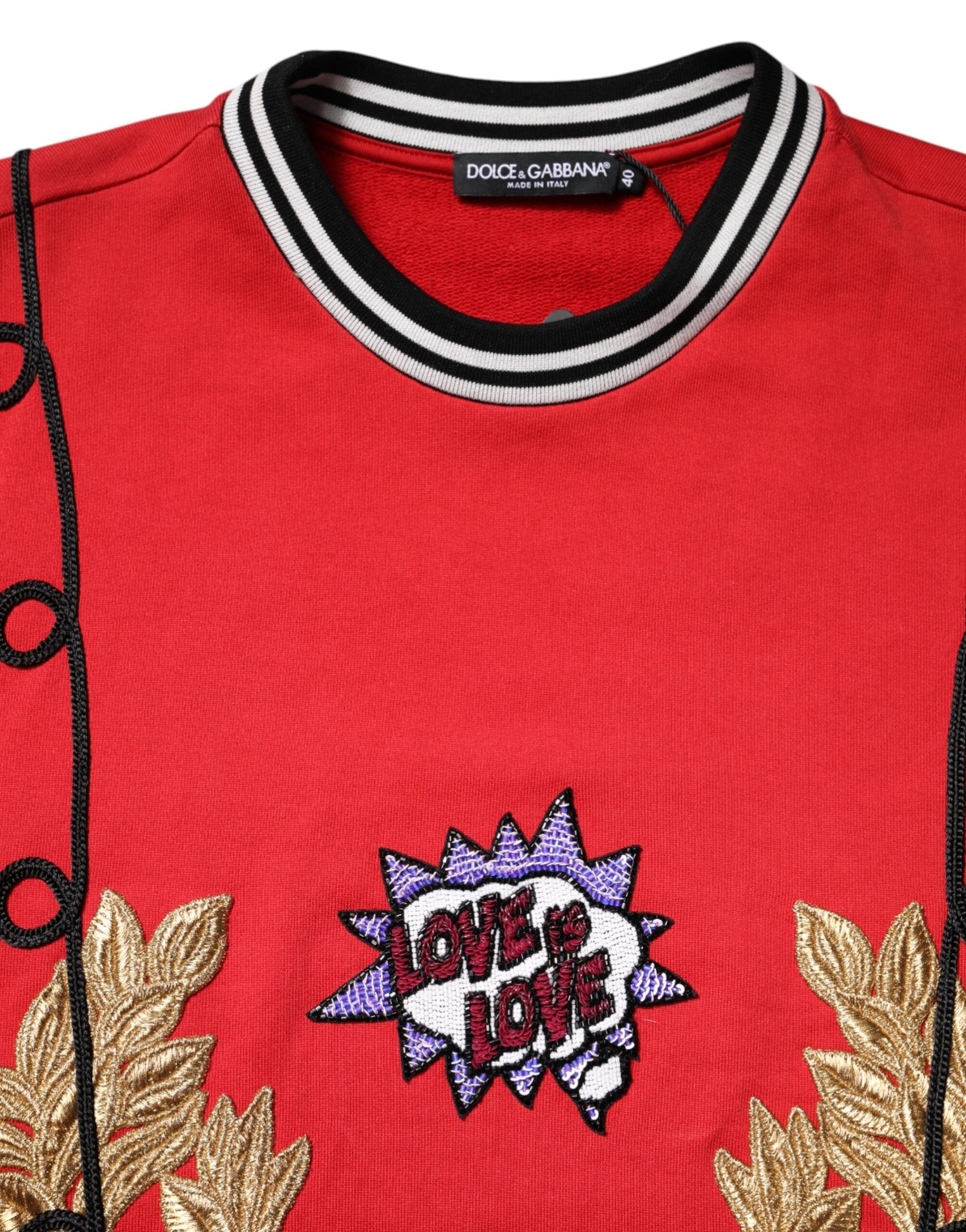 Red sweater with gold embroidery on front
