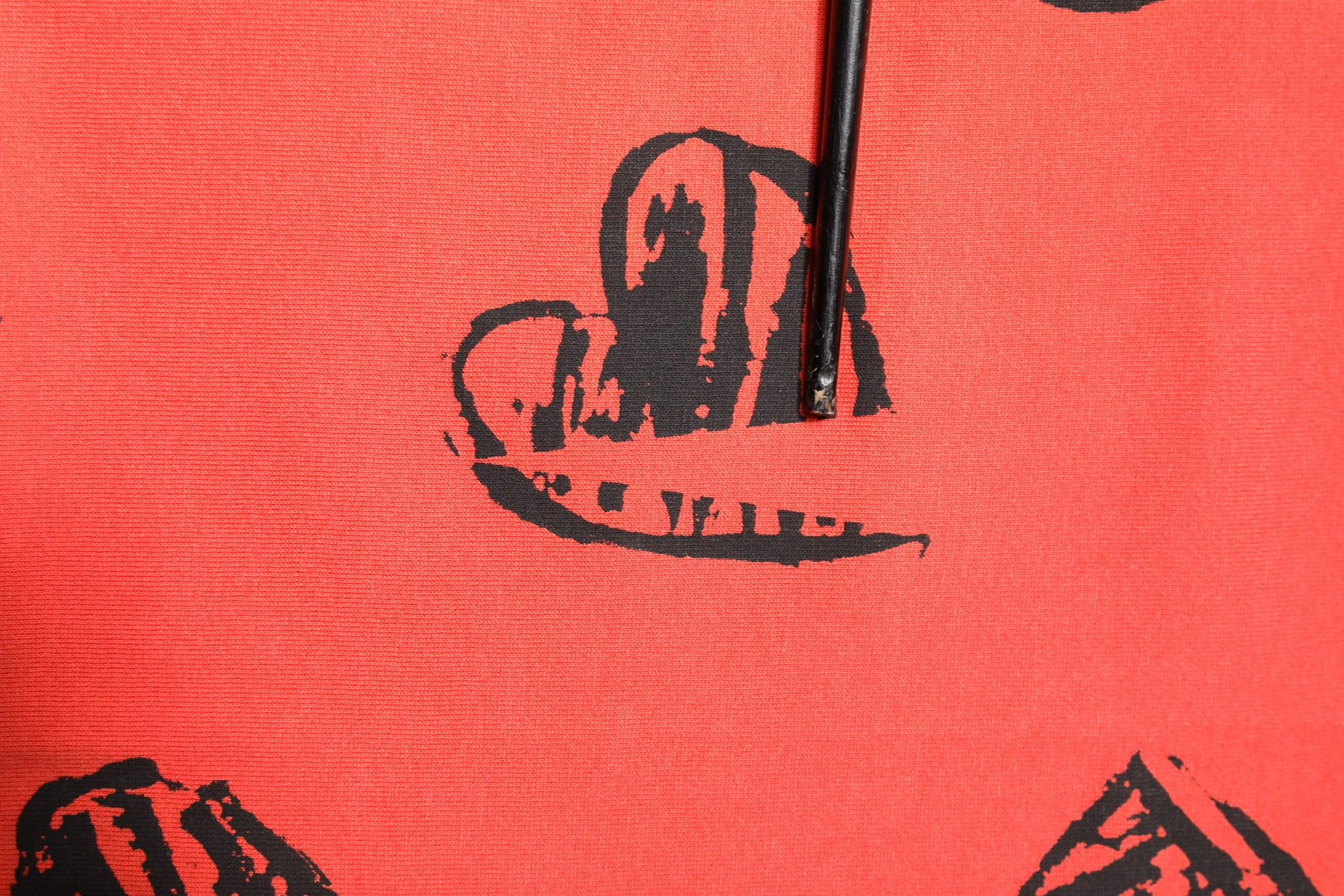 Red fabric with cowboy hat design