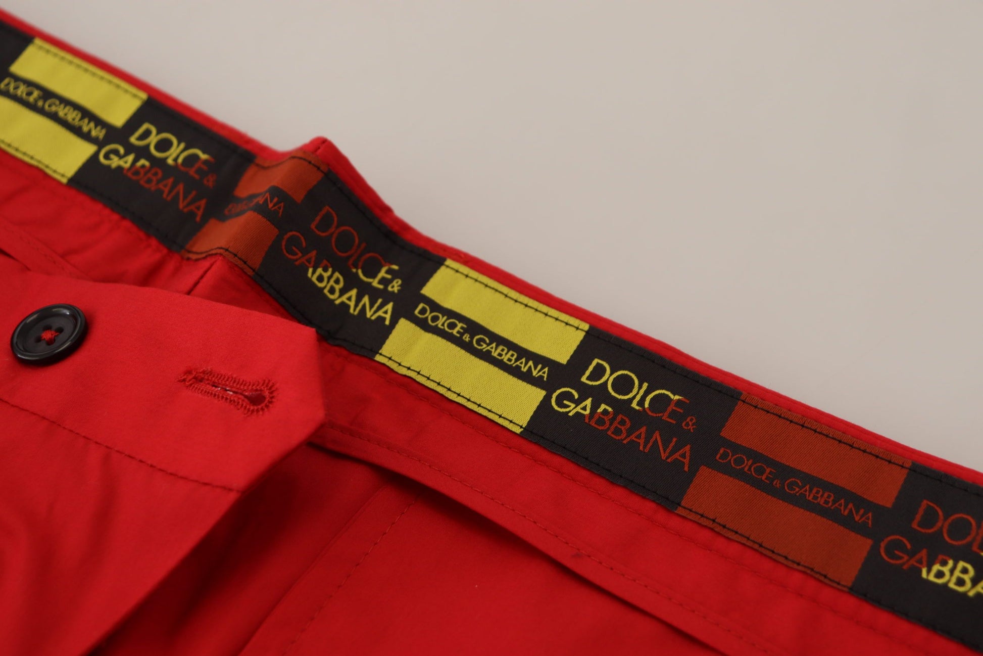 Red jacket with yellow stripe on waistband