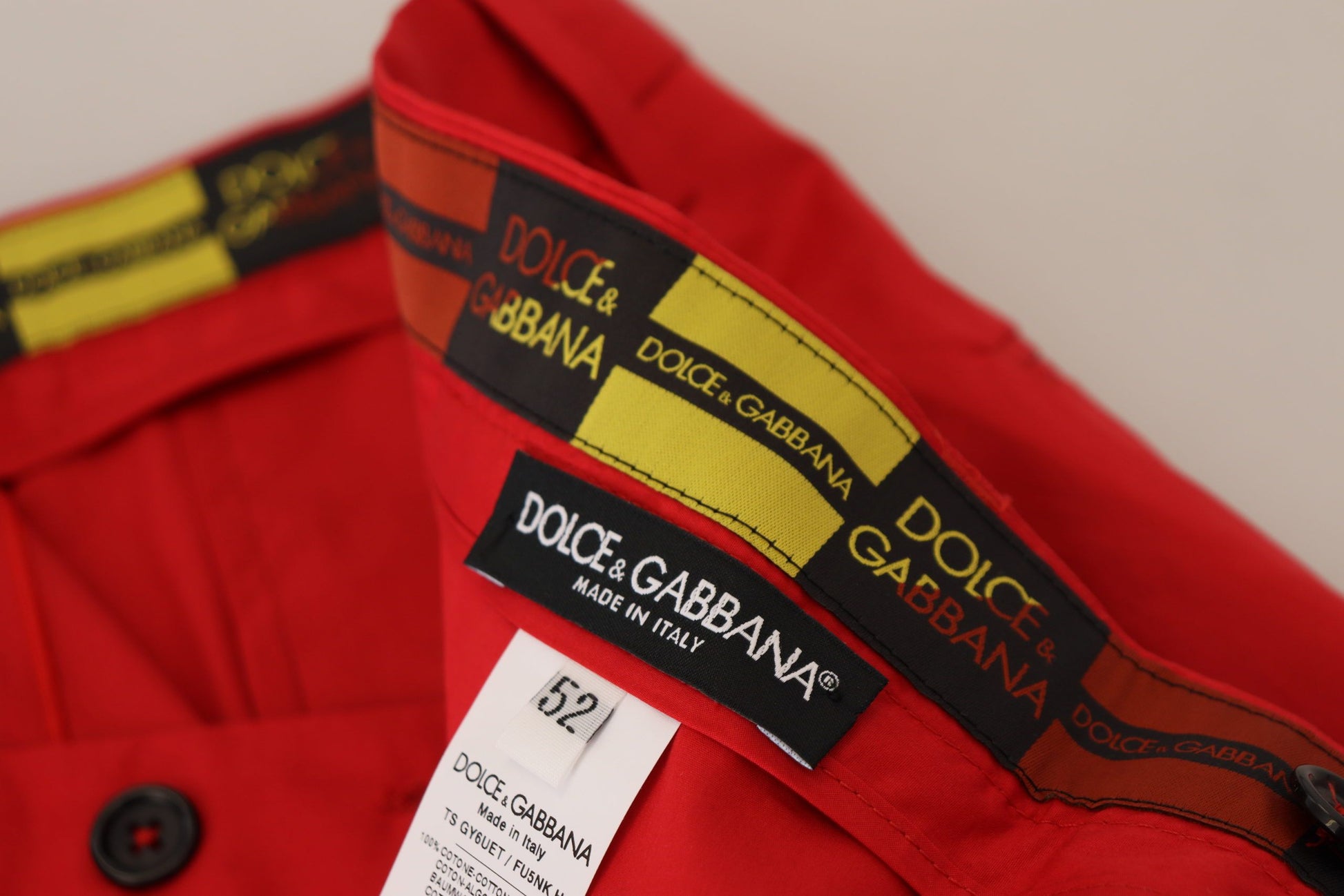 Red shirt with yellow and black stripes on sleeve