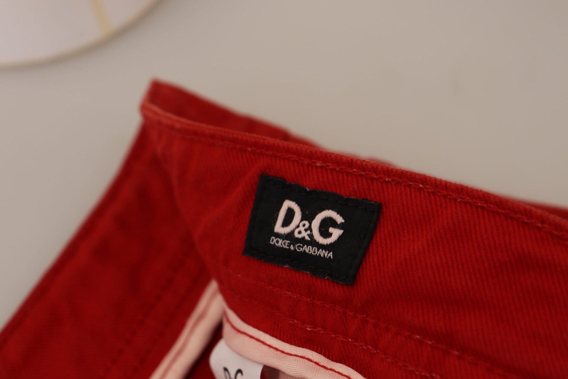 Red pants with black label on waistband