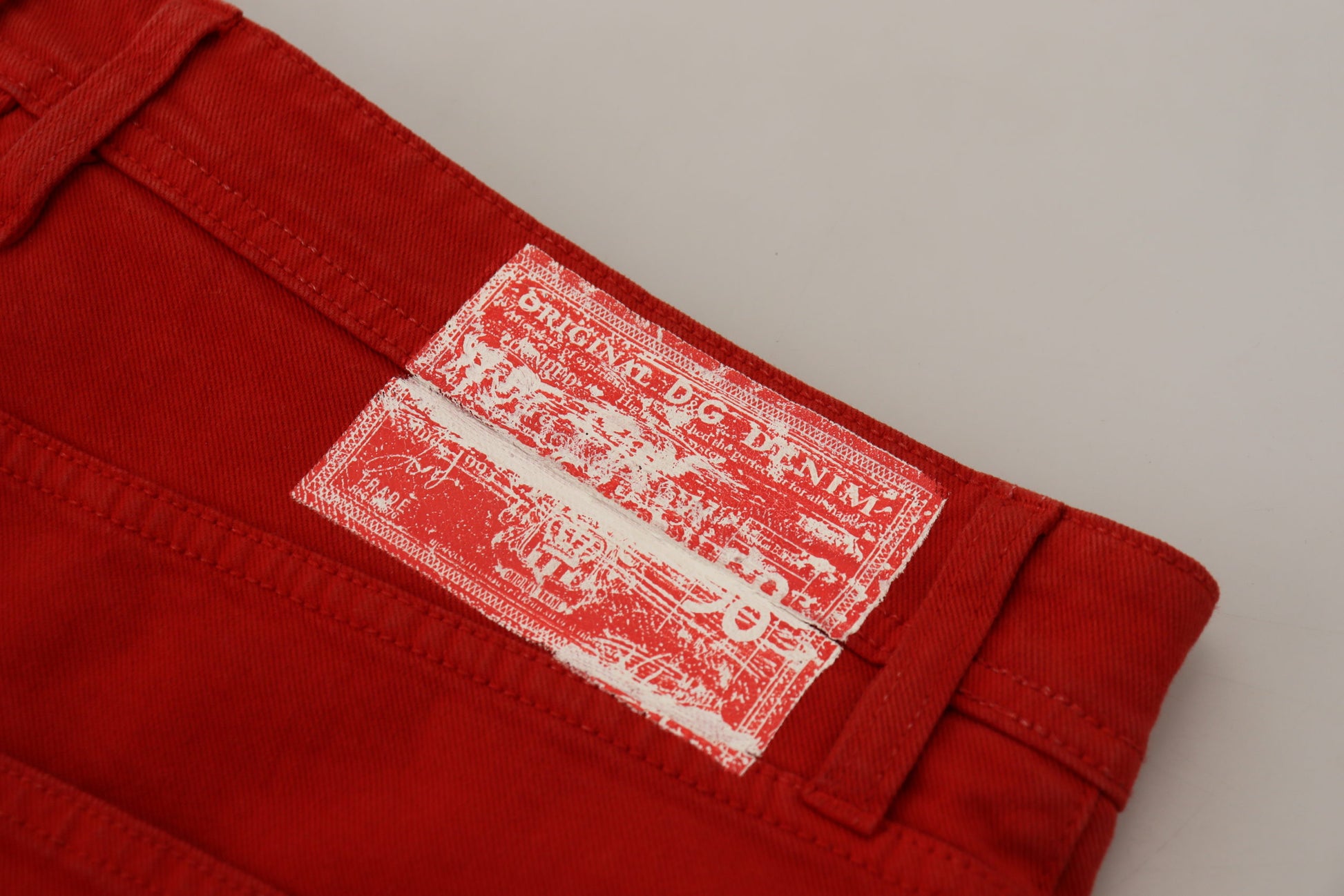 Red shorts with white patch on left leg