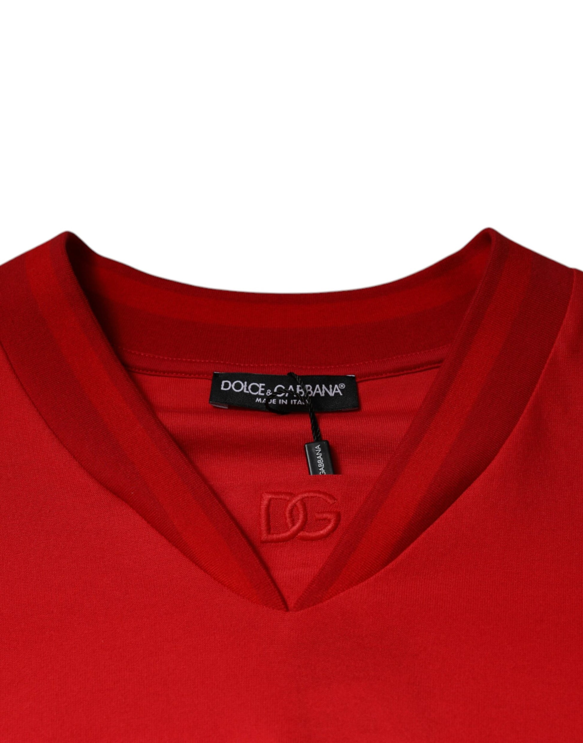 Red v neck sweater with brand label on front