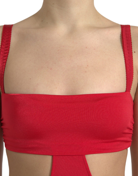 A red sleeveless dress with cutouts and a sheer nylon fabric