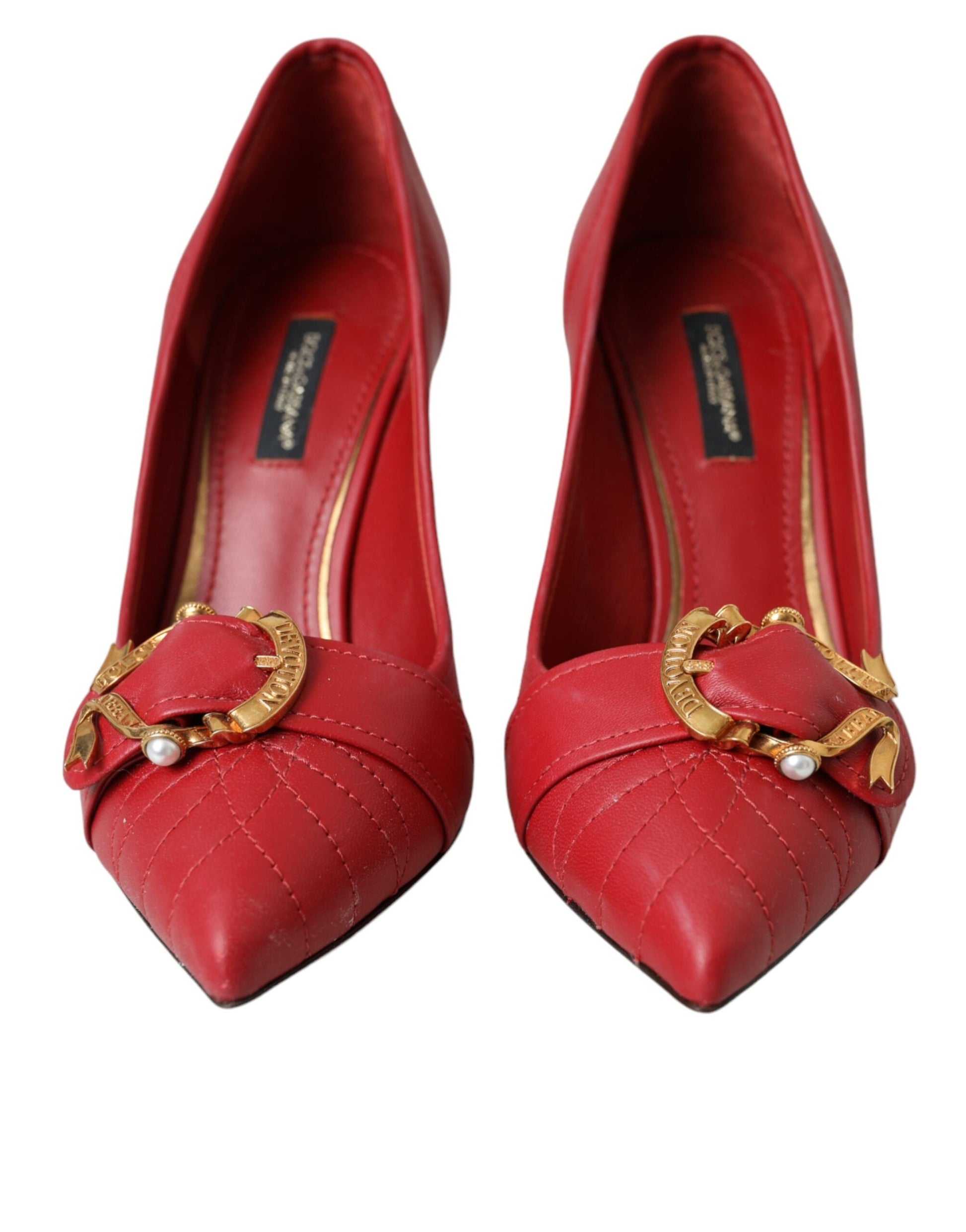 Red high heel shoes with gold buckle