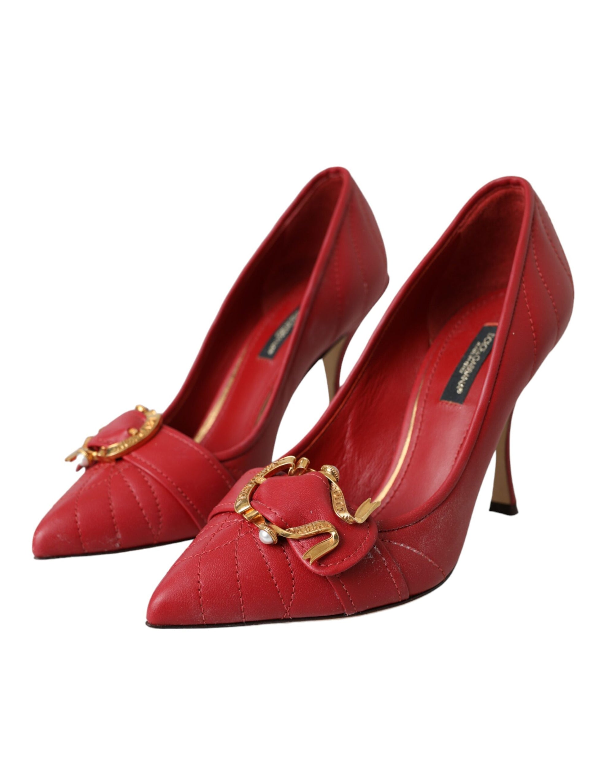 Red high heel shoes with gold accents