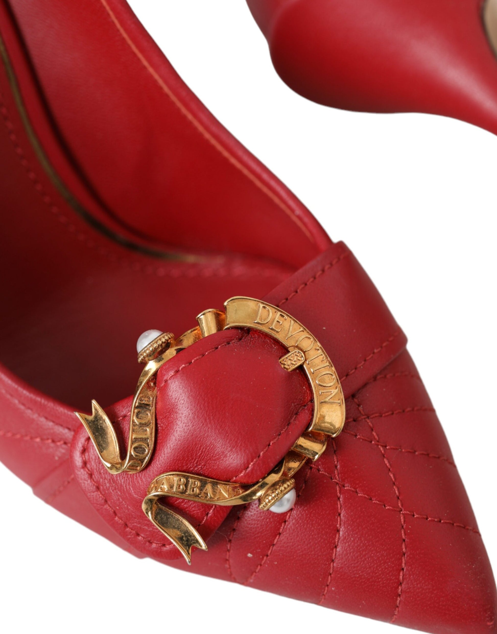 Red shoe with gold buckle