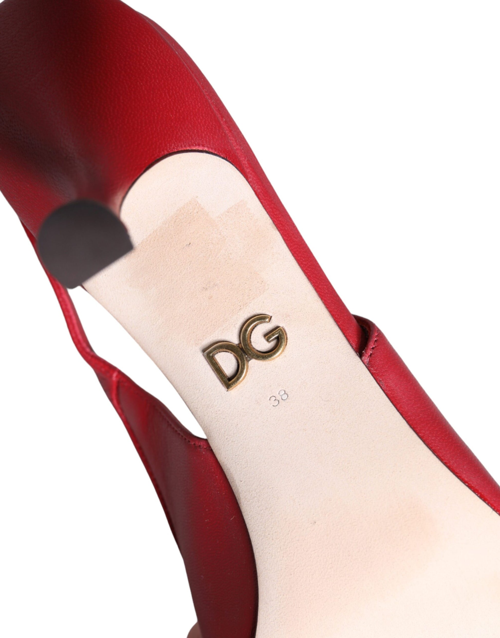 Red high heel shoe with gold logo on insole