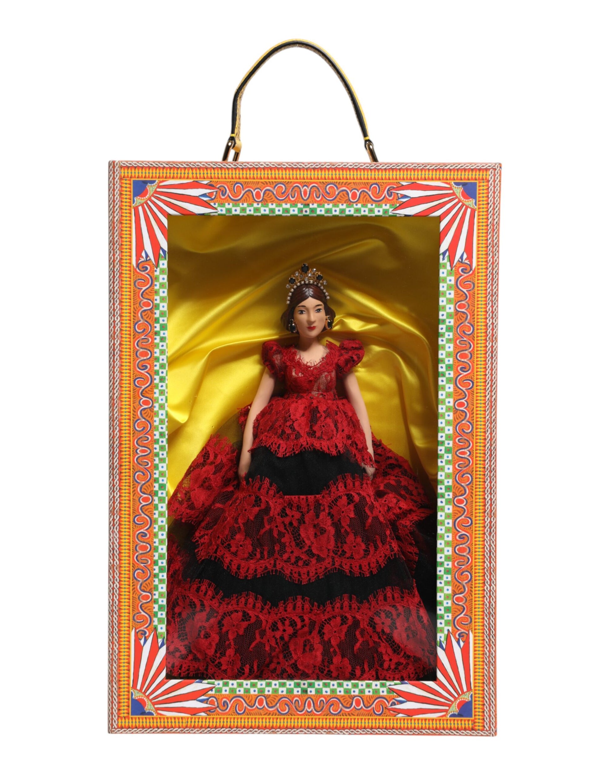 A porcelain doll wearing a red dress with lace details