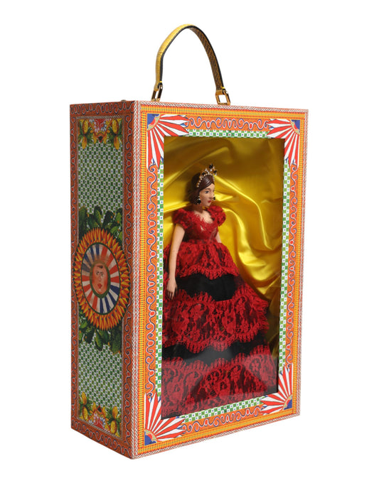 A ceramic porcelain fashion box with a red dress and leather details, featuring a doll in a red dress