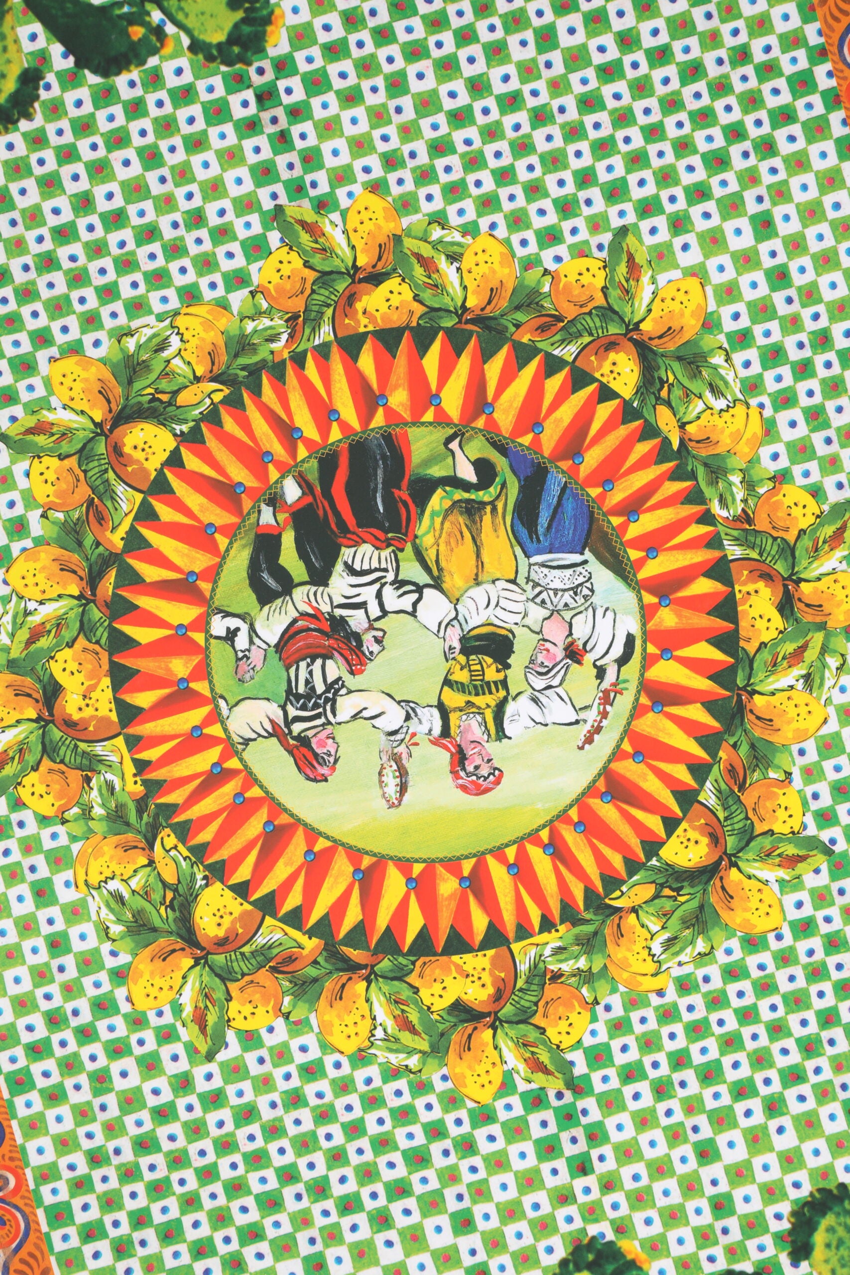 A colorful ceramic porcelain box with a red dress and leather dolls