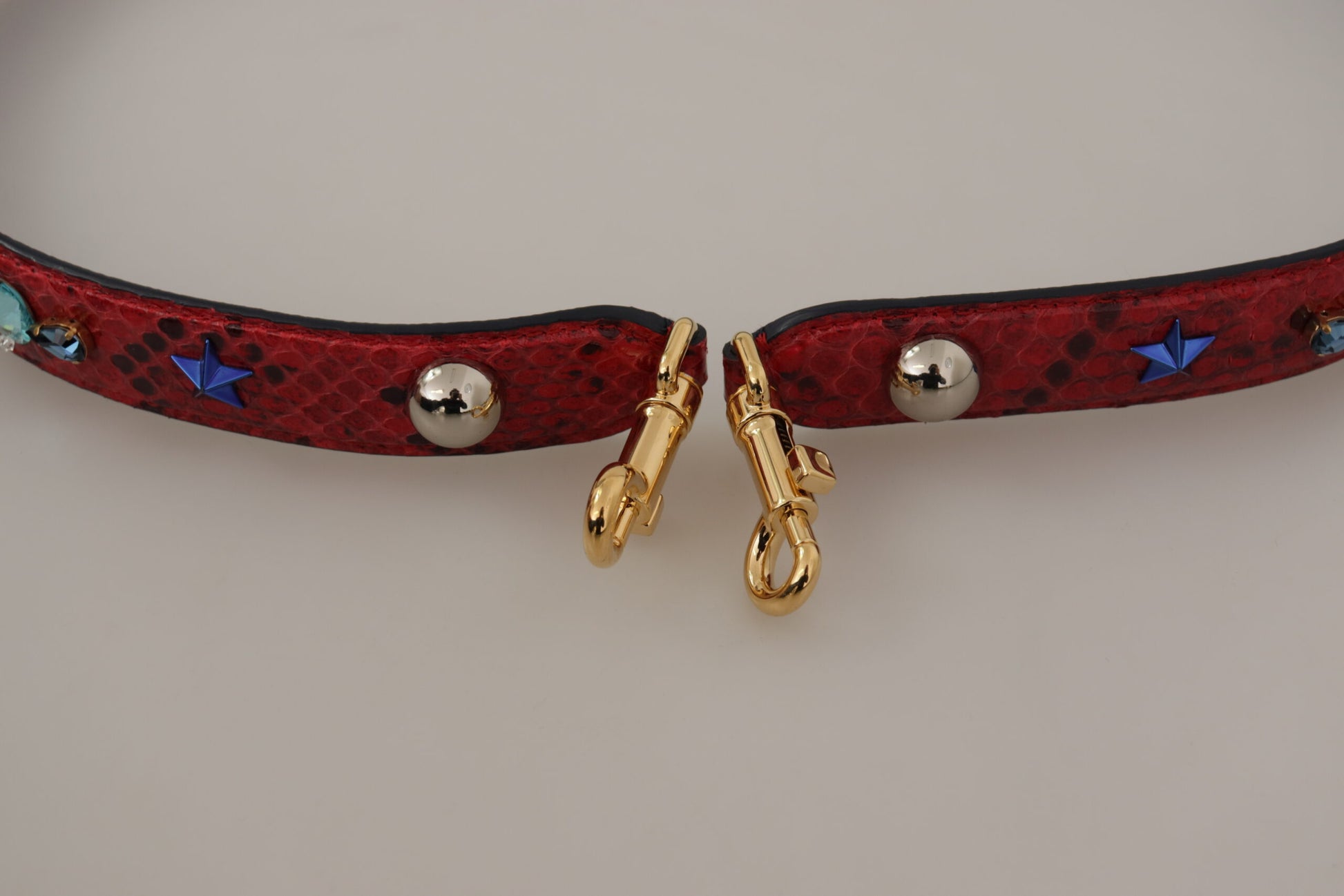 Red collar with gold buckle and silver beads