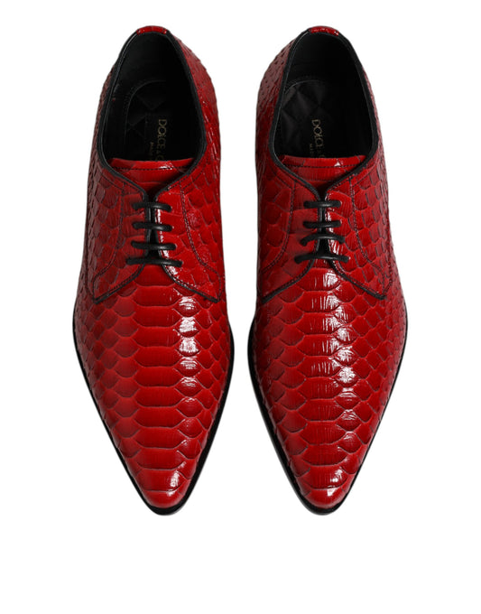 Pair of red exotic leather lace-up dress shoes with a shiny finish