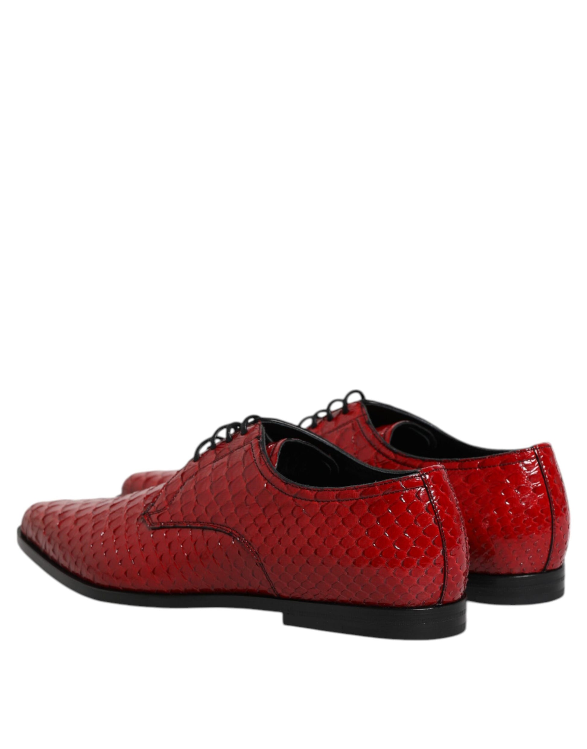 Pair of red lace-up dress shoes with exotic leather and shiny accents