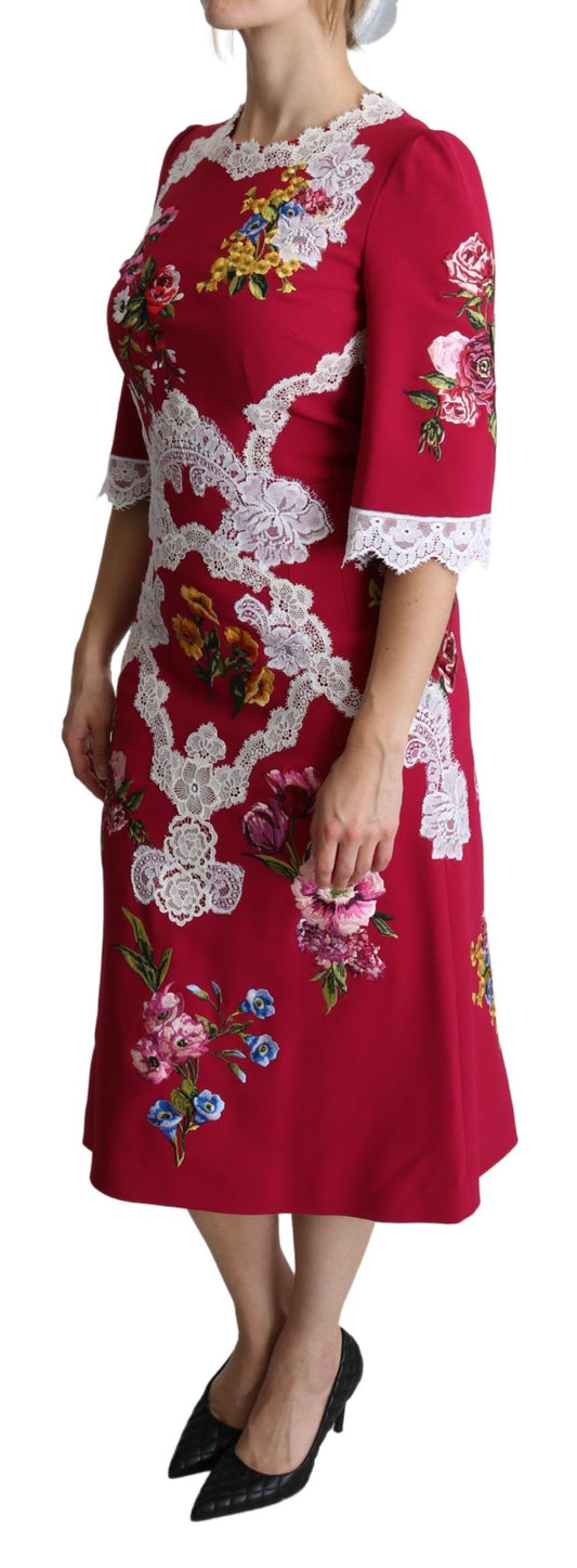 A red midi dress with floral embroidery and lace detailing