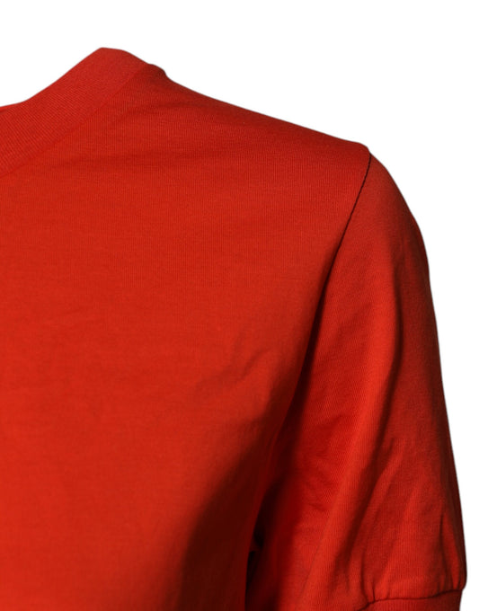 Red long sleeve shirt on a mannequin