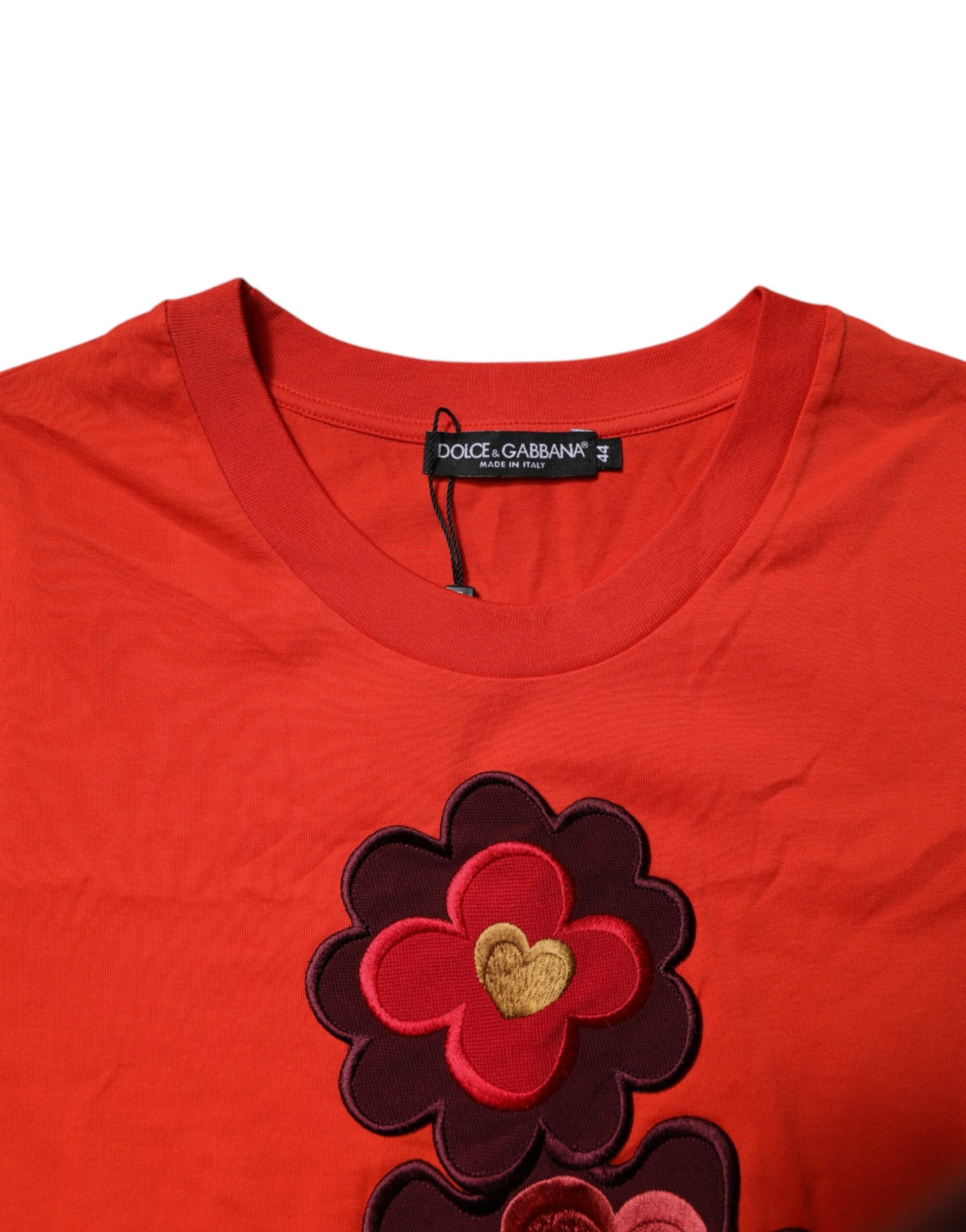 Red sweater with flower embroidery on front