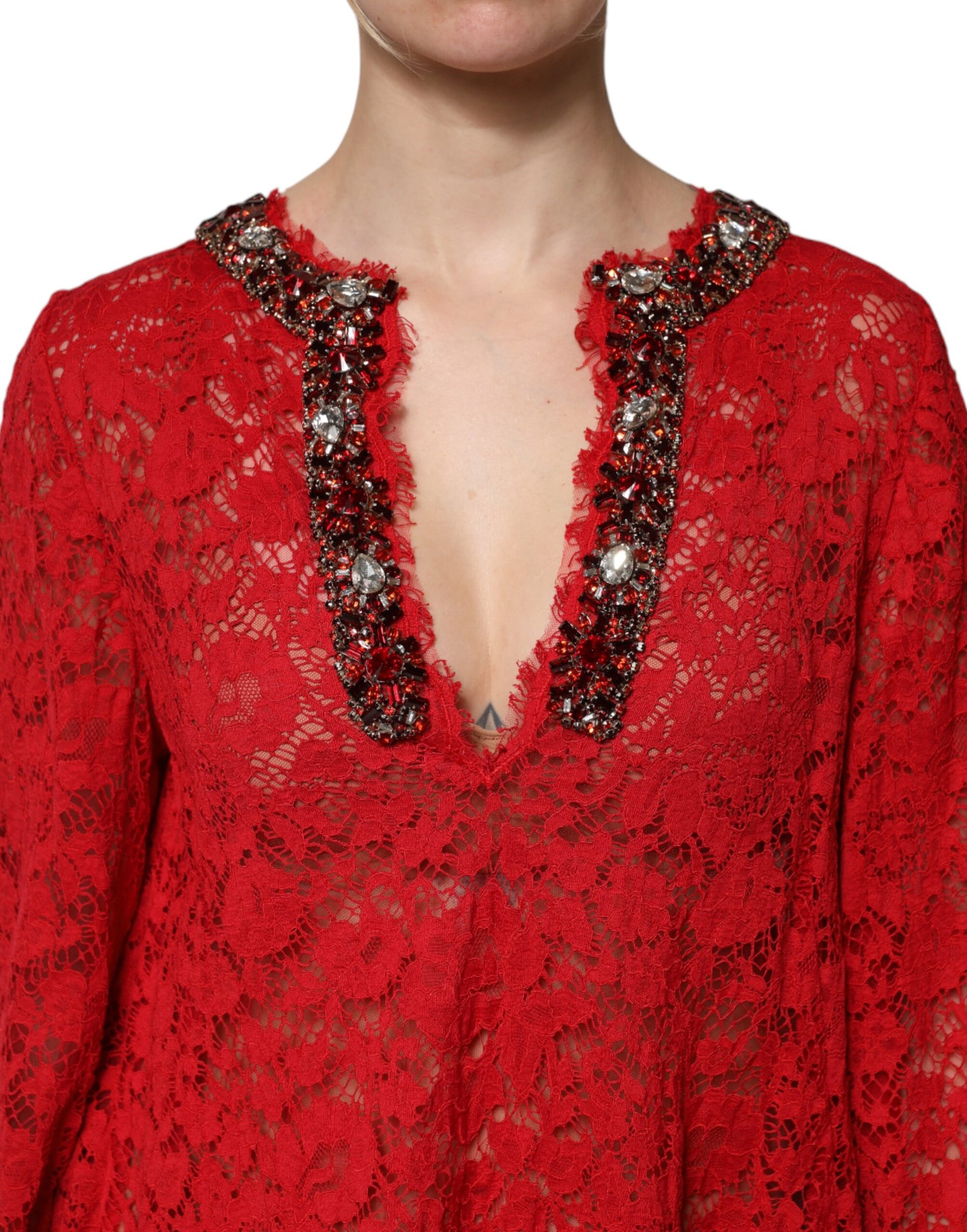 A red lace dress with rhinestone embellishments and a floral pattern