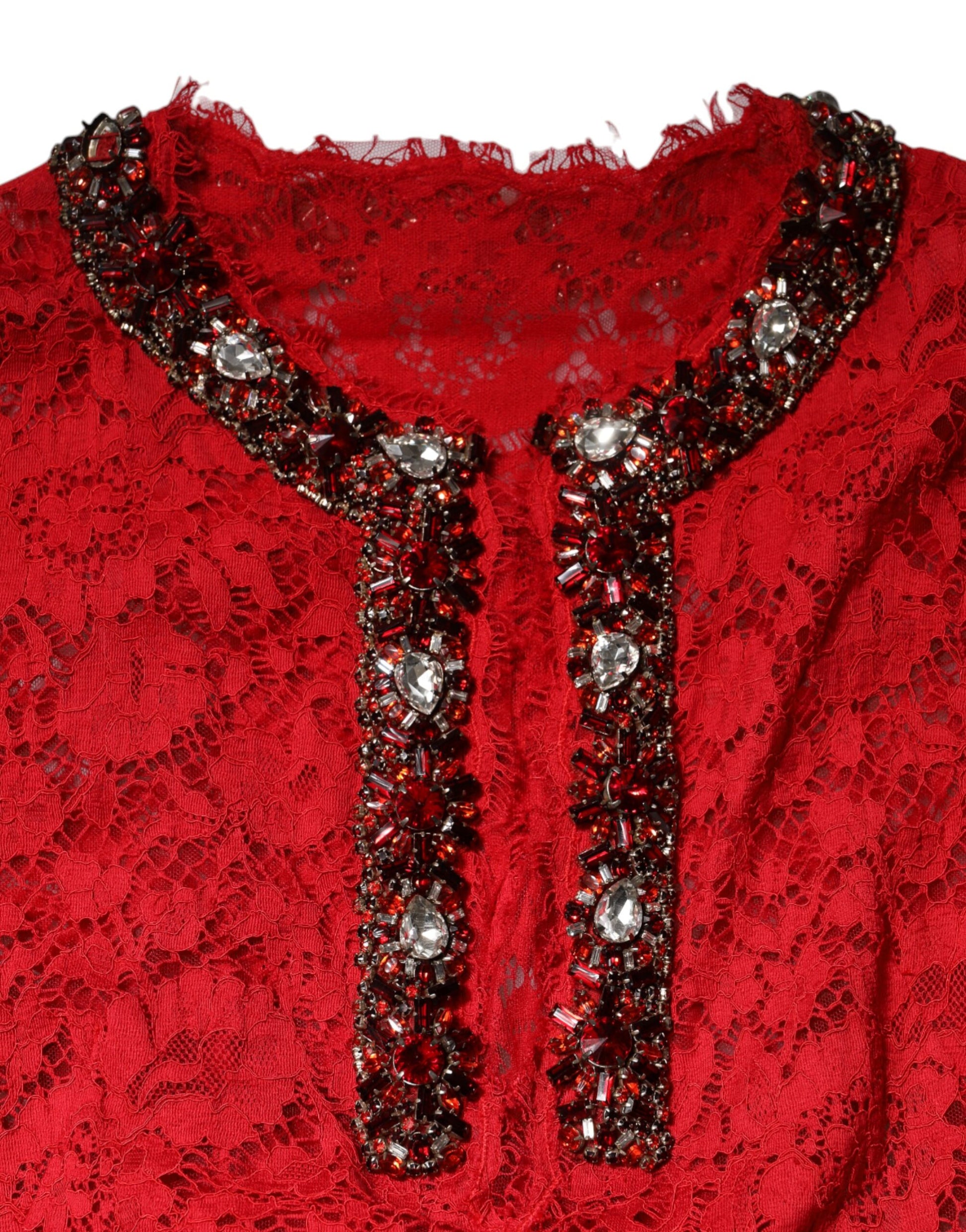 A red lace dress with rhinestone embellishments on the neckline and sleeves
