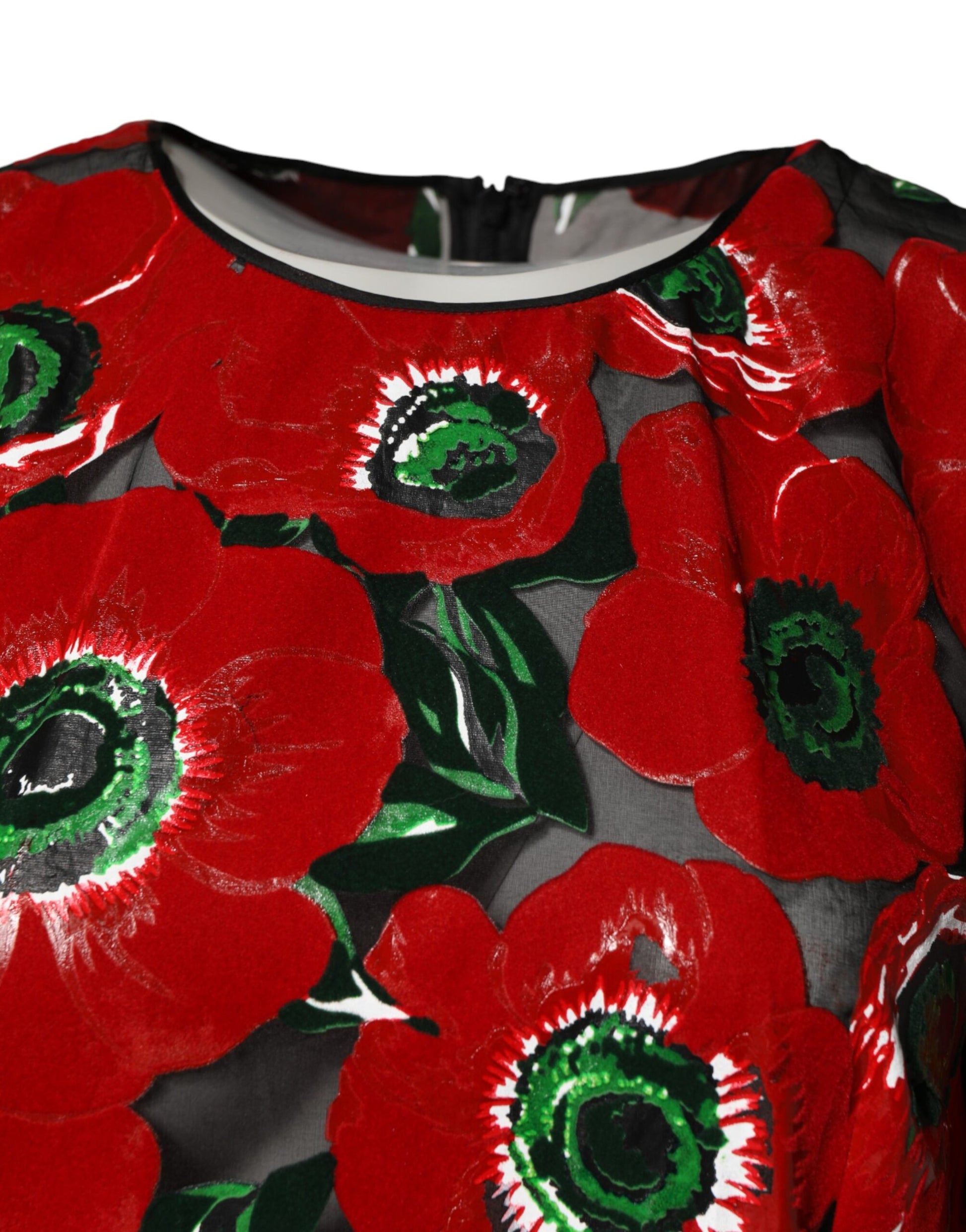 A nylon midi dress with a red floral print and black trim