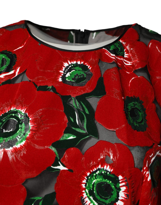 A nylon midi dress with a red floral print and black trim