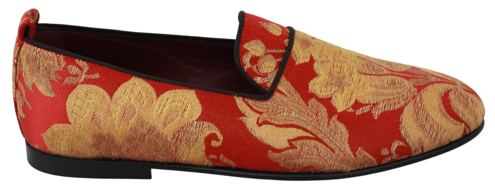 Red and gold patterned shoes with a bow on top
