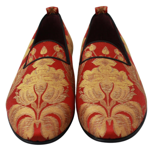 Pair of red and gold embroidered shoes with black soles