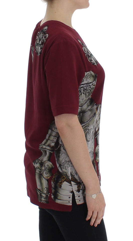Woman wearing maroon shirt with graphic design on back
