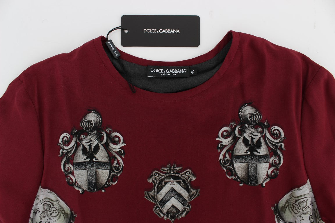 Red embroidered sweater on hanger