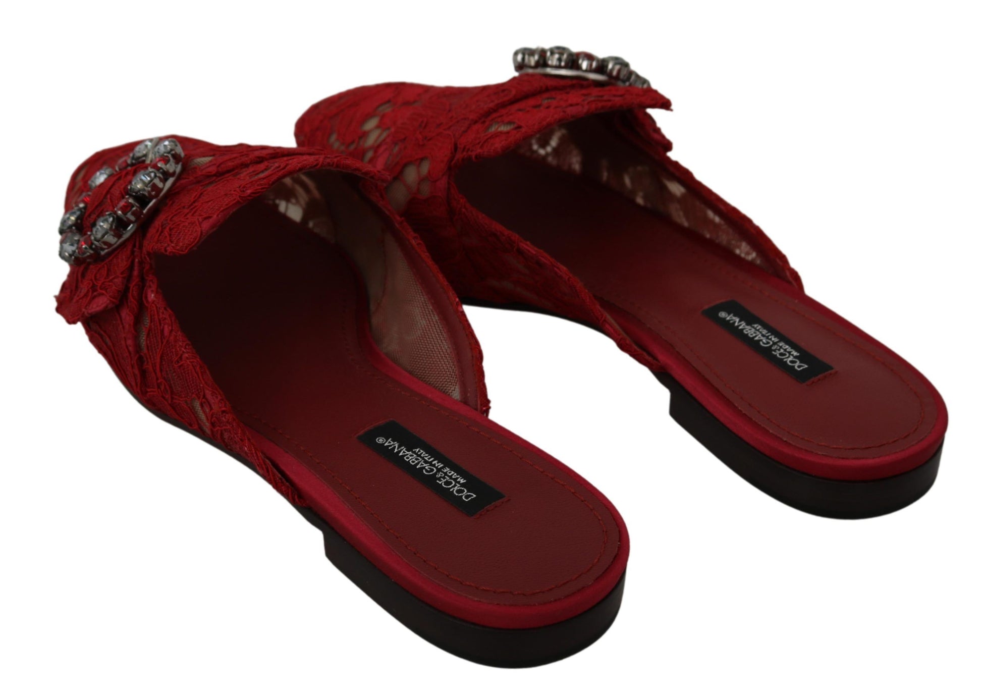 Pair of red women's sandals with embellishments and a bow on top