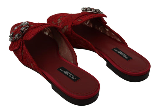 Pair of red women's sandals with embellishments and a bow on top