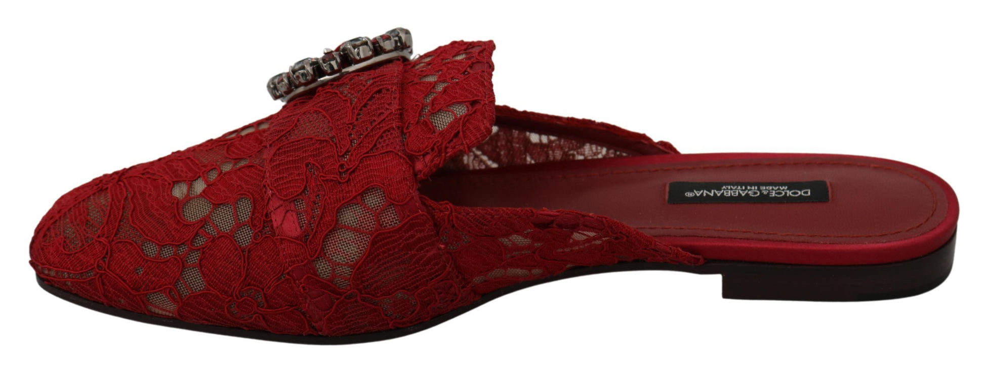 Red lace-up shoes with a bow on top and a strap across the foot