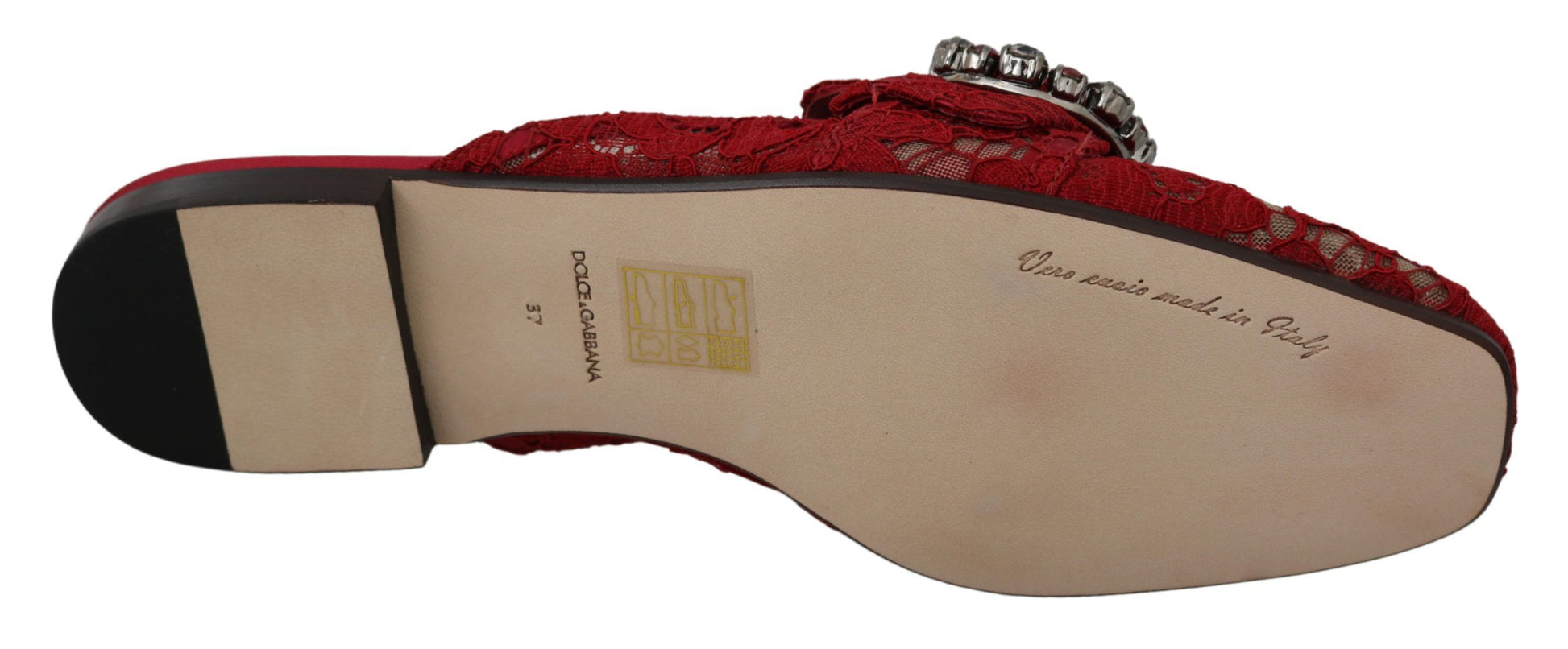 Pair of red and white shoes with embroidery on top
