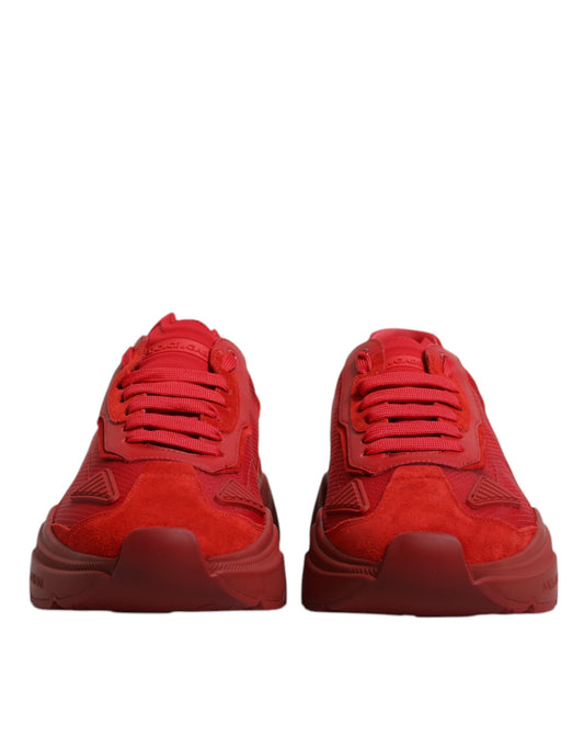 Pair of red sneakers with white laces