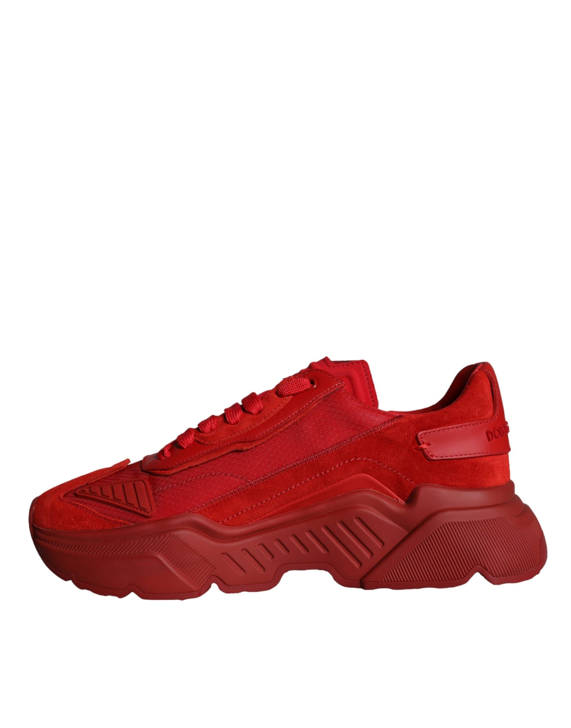 Red leather sneakers with white soles, featuring a low top design and the brand's logo