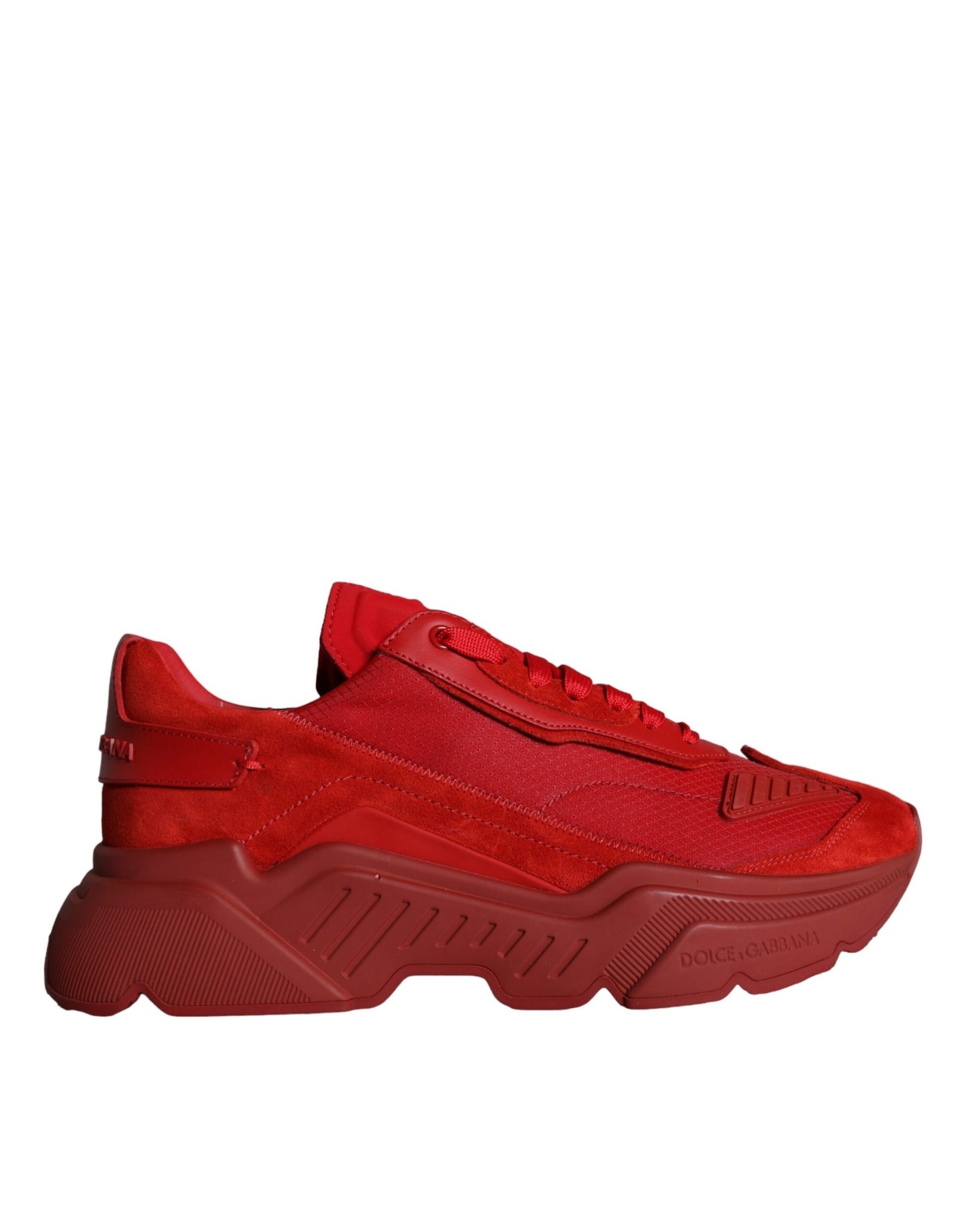 Red leather sneakers with white soles, featuring a low top design and the Dolce & Gabbana logo