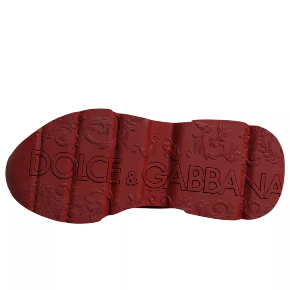 Red shoe with gold design on sole