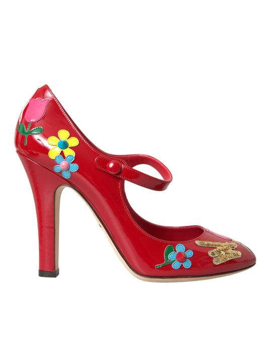 Red high heel shoe with floral embellishments and gold accents